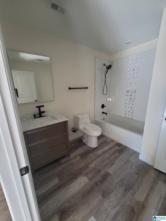 full bathroom with toilet, shower / bath combination, wood-type flooring, and vanity