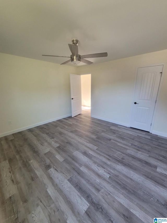 unfurnished room featuring ceiling fan and hardwood / wood-style floors