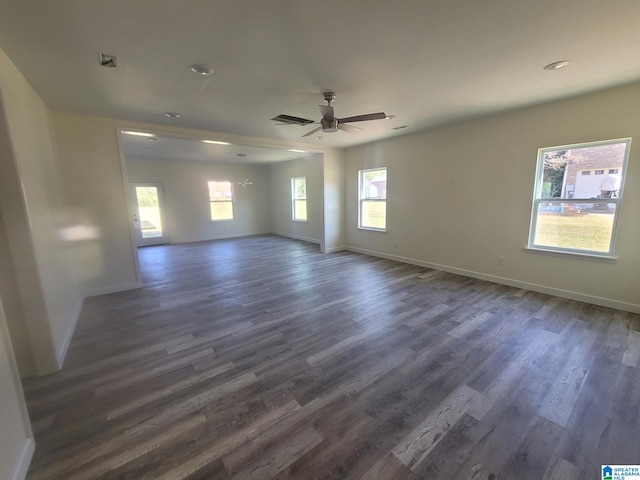 unfurnished room with ceiling fan and dark hardwood / wood-style flooring