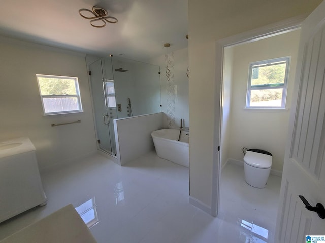 bathroom featuring plus walk in shower, toilet, and tile patterned flooring