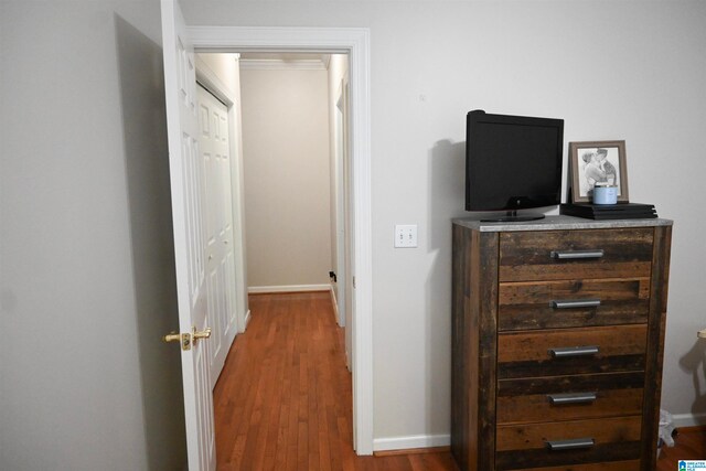 corridor featuring hardwood / wood-style floors