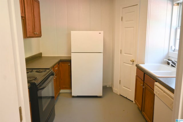 kitchen featuring white appliances and sink