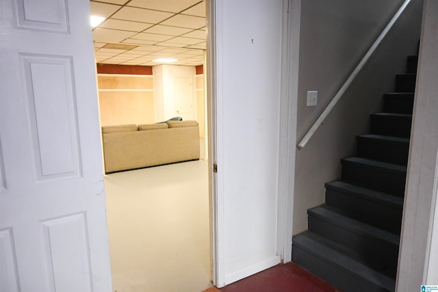 stairway featuring a paneled ceiling