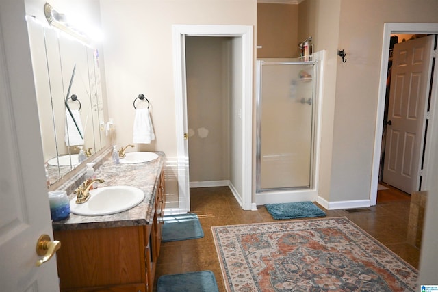 bathroom with walk in shower, tile patterned floors, and vanity