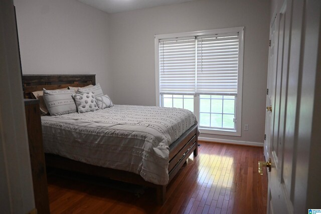 bedroom featuring dark hardwood / wood-style floors