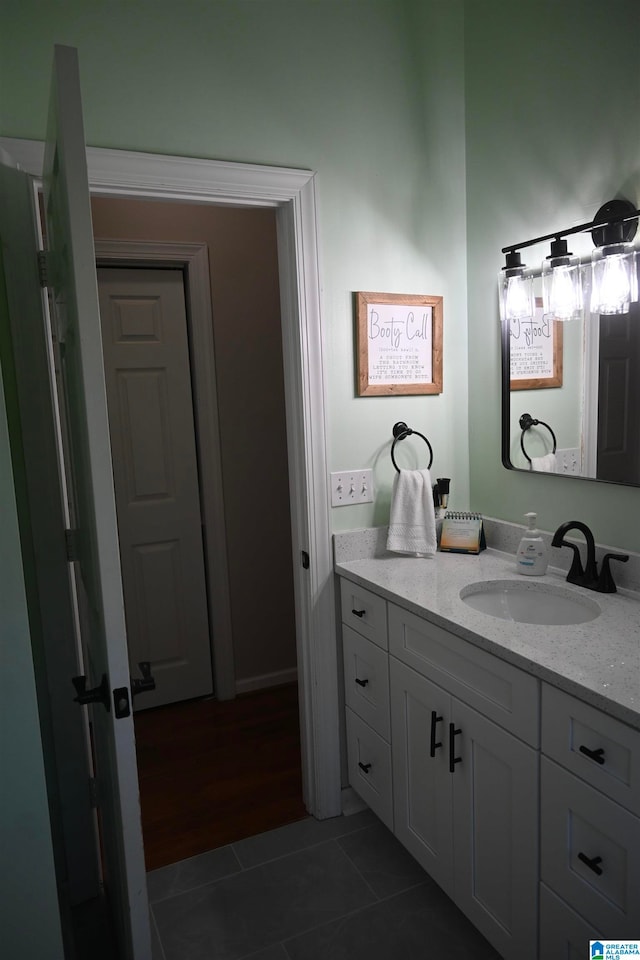 bathroom featuring wood-type flooring and vanity