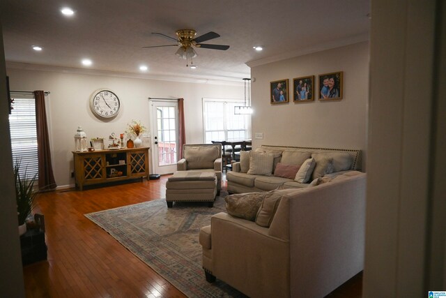 living room with ceiling fan, hardwood / wood-style flooring, and crown molding