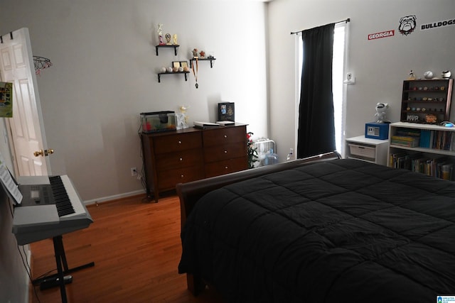 bedroom featuring wood-type flooring