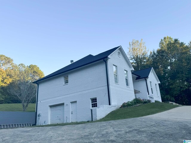 view of side of property featuring a garage