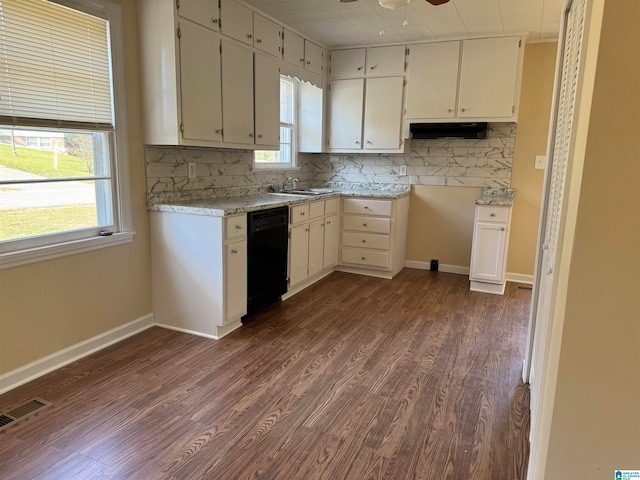 kitchen featuring a wealth of natural light, dark wood-type flooring, white cabinets, and dishwasher