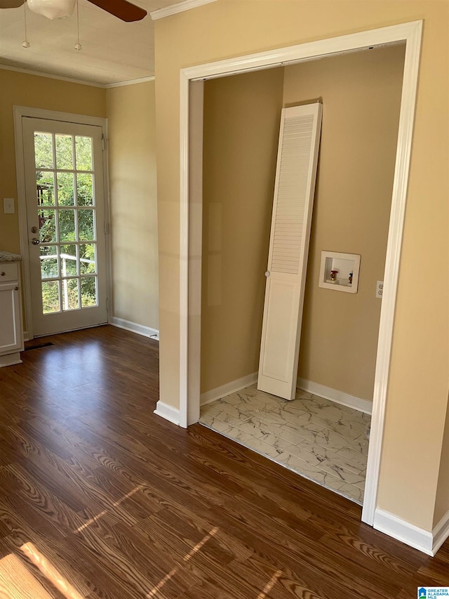 interior space with ornamental molding, ceiling fan, and dark hardwood / wood-style flooring