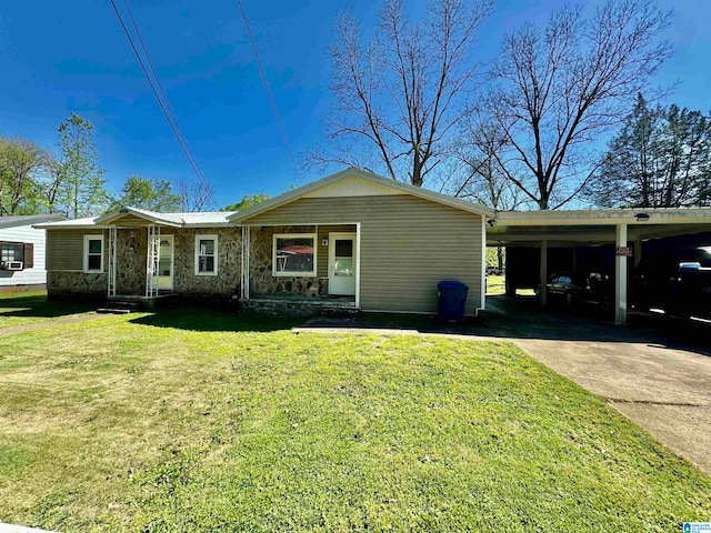 ranch-style house featuring a front lawn and a carport