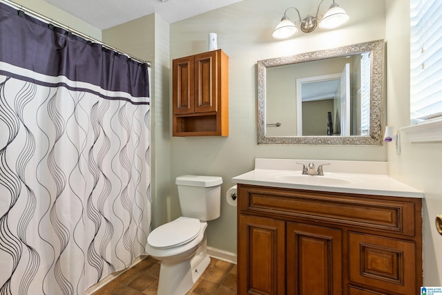 bathroom with a notable chandelier, vanity, toilet, and a textured ceiling