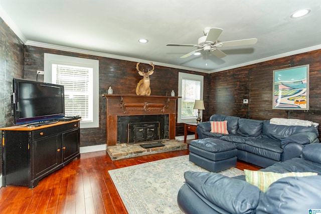 living room featuring crown molding, dark hardwood / wood-style floors, and ceiling fan