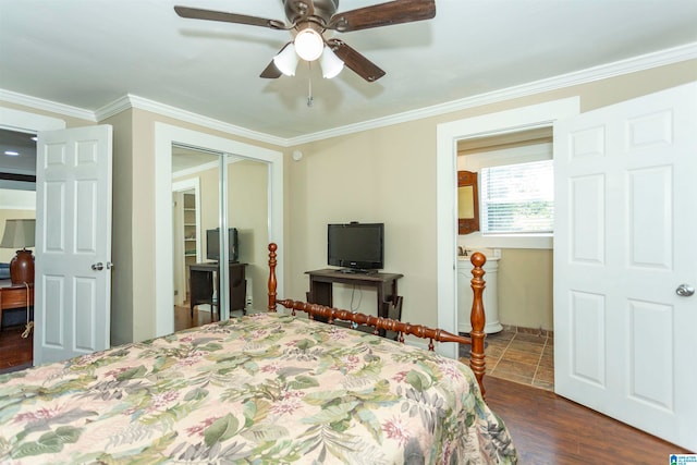 bedroom with crown molding, ceiling fan, and a closet