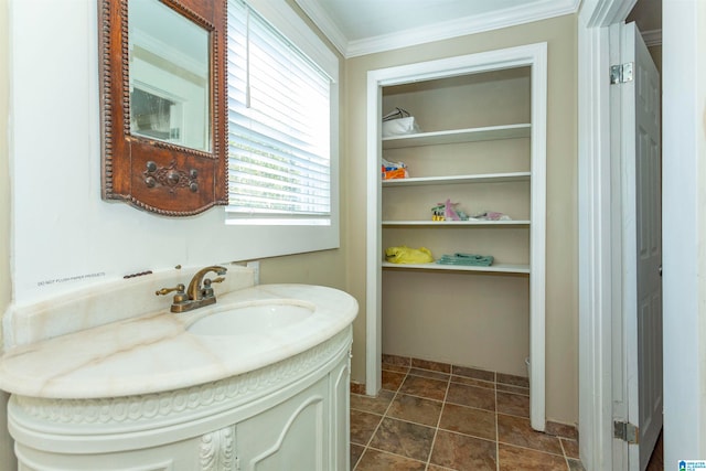 bathroom featuring ornamental molding and vanity