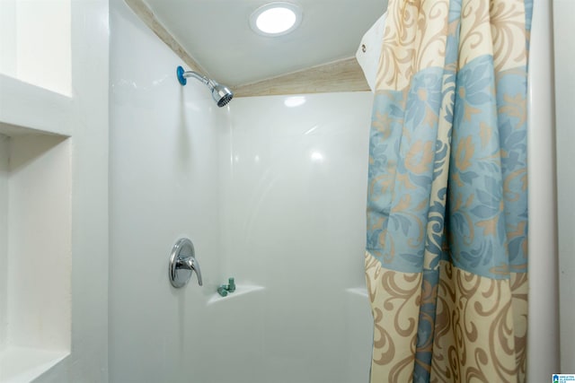 bathroom with a shower with curtain