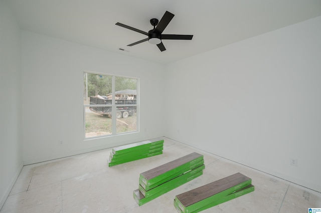 interior space with ceiling fan