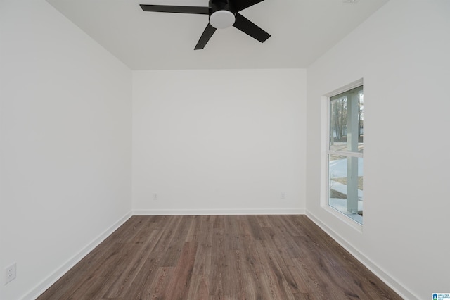 unfurnished room featuring dark hardwood / wood-style flooring and ceiling fan