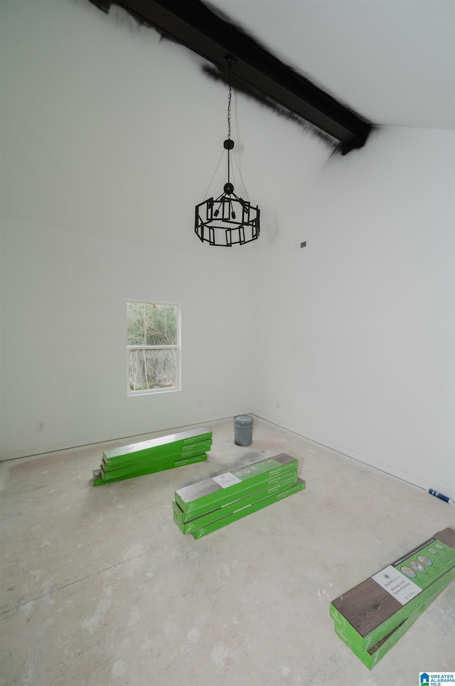 interior space featuring vaulted ceiling with beams