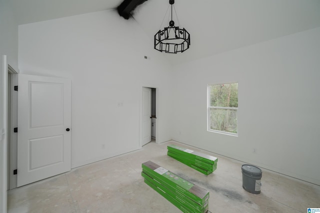 interior space featuring beam ceiling and high vaulted ceiling