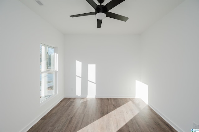 spare room featuring ceiling fan and hardwood / wood-style flooring