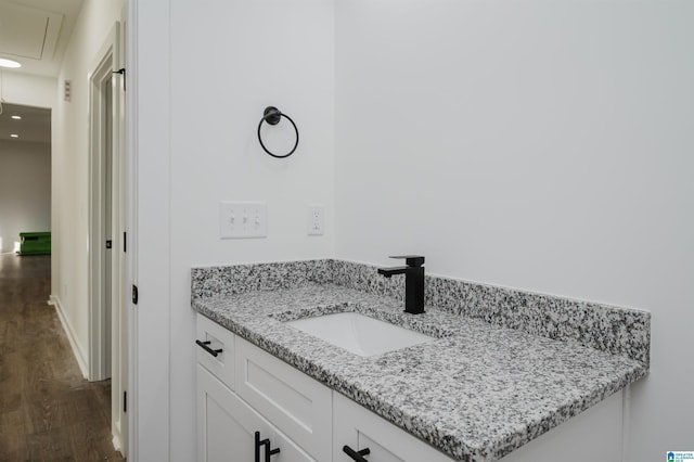 bathroom featuring vanity and hardwood / wood-style flooring