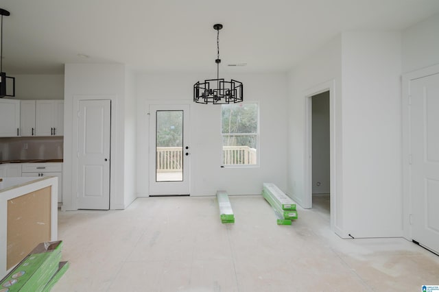 dining space featuring an inviting chandelier