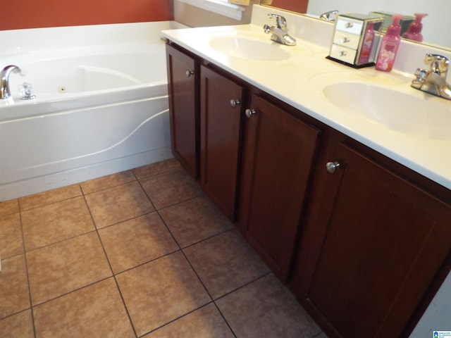 bathroom with vanity, tile patterned flooring, and a bathing tub