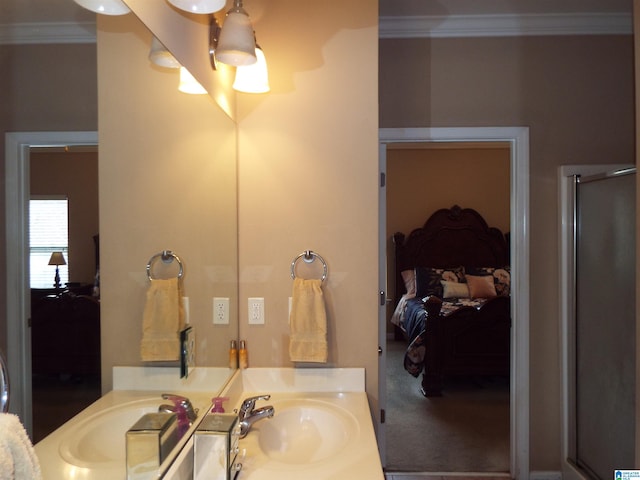 bathroom with vanity, an enclosed shower, and crown molding