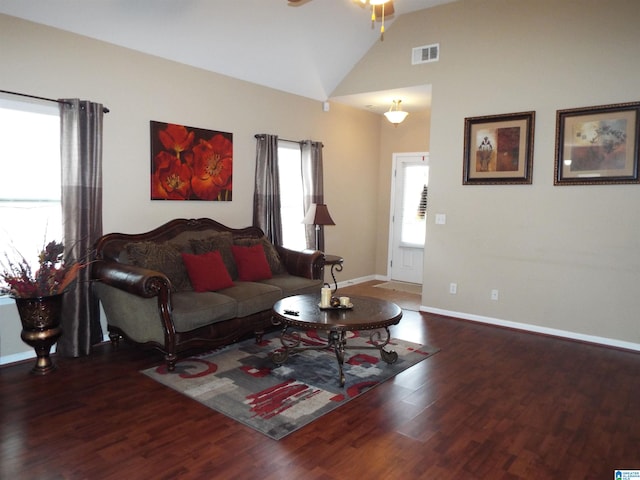 living room with hardwood / wood-style floors, high vaulted ceiling, and ceiling fan