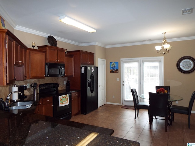 kitchen featuring ornamental molding, black appliances, and a chandelier