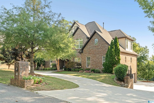 view of side of property featuring a yard