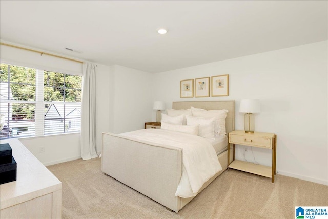 bedroom with light colored carpet