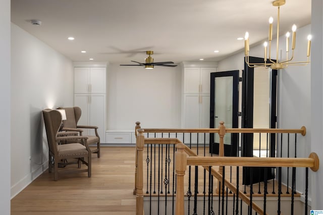 interior space featuring light hardwood / wood-style floors and a chandelier