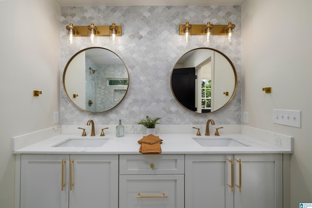 bathroom with vanity and a shower