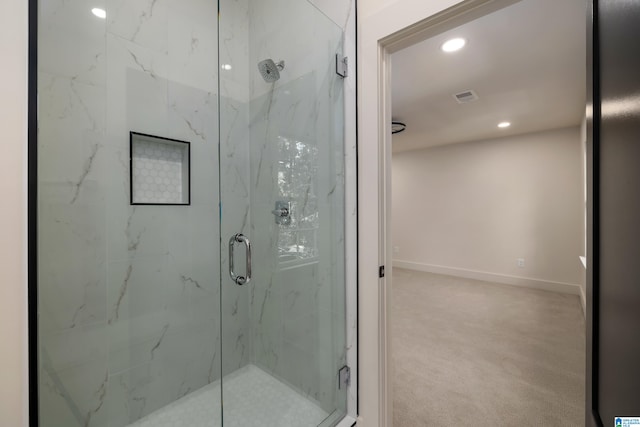 bathroom featuring an enclosed shower