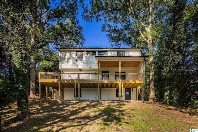 view of front facade with a garage and a deck