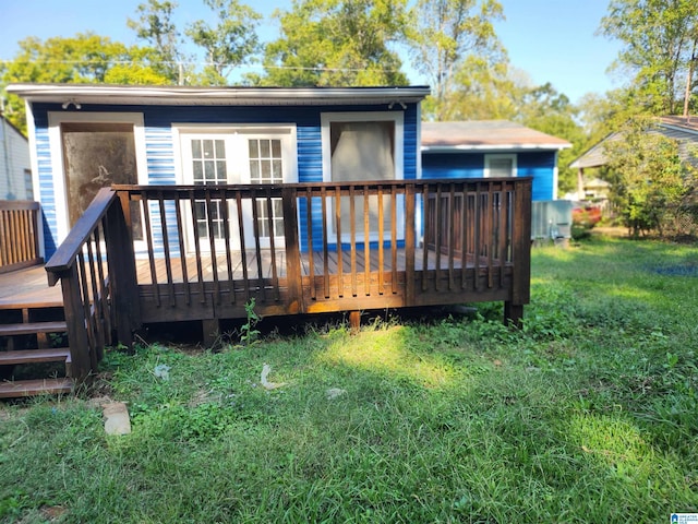 back of house with a wooden deck