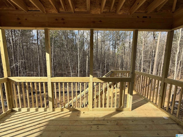 deck featuring a forest view