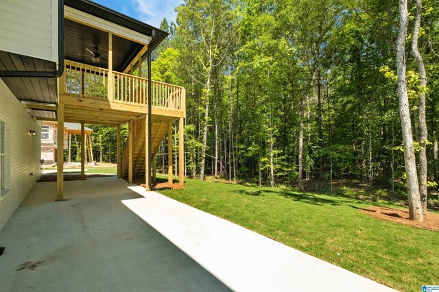1146 Grey Oaks Vly, Pelham, AL 35124 - view of green lawn featuring a ceiling fan, stairs, a wooden deck, a patio area, and concrete driveway