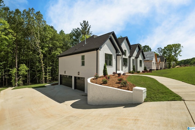 1146 Grey Oaks Vly, Pelham, AL 35124 - view of side of home with a garage, concrete driveway, and a lawn
