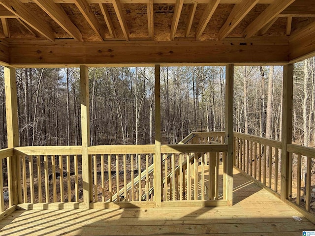 wooden terrace with a forest view