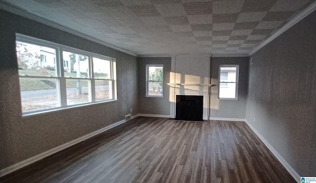 unfurnished living room featuring hardwood / wood-style floors and ornamental molding