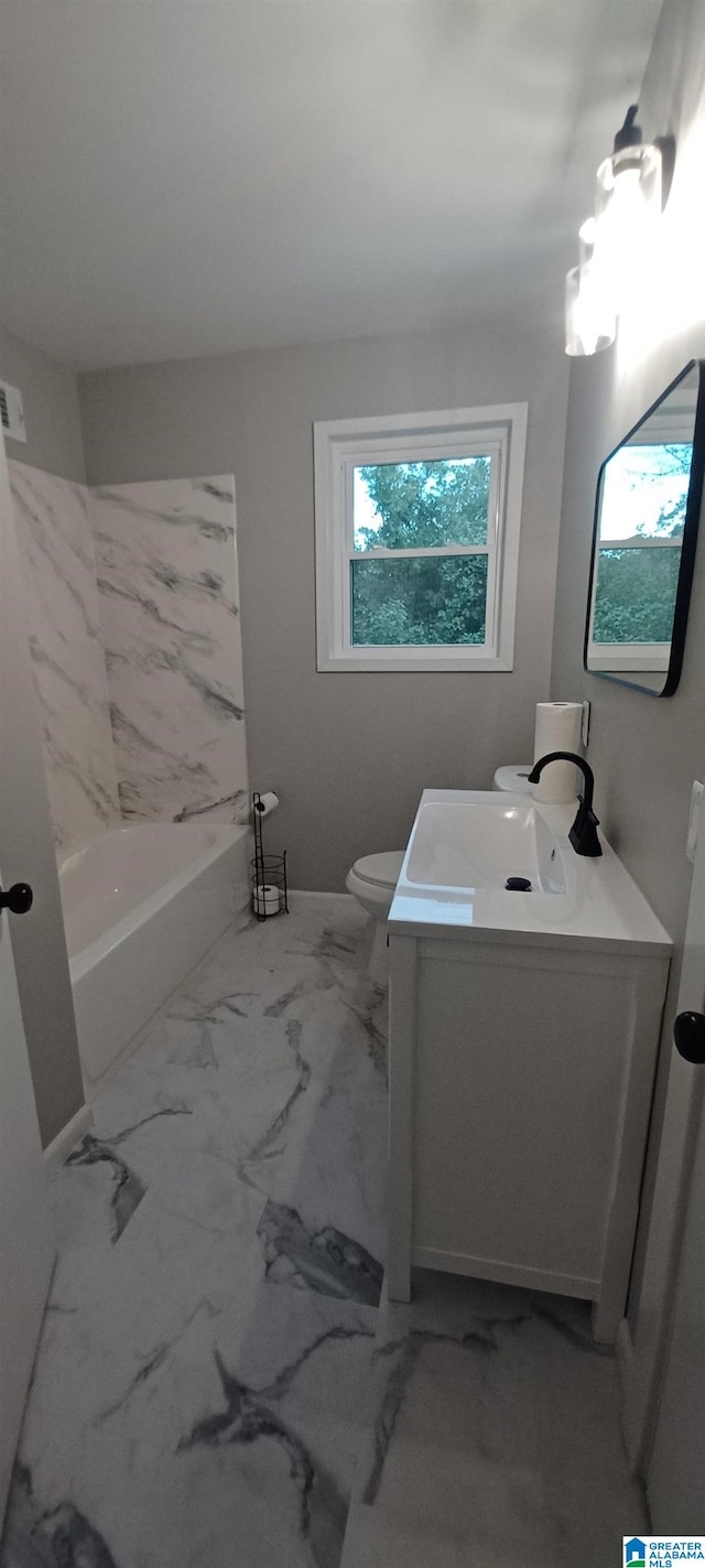 full bathroom featuring a healthy amount of sunlight, toilet, tub / shower combination, and vanity