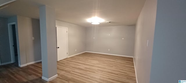 empty room featuring wood-type flooring