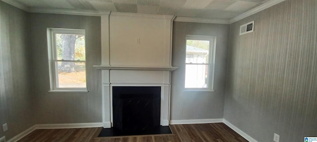 unfurnished living room featuring dark hardwood / wood-style flooring, crown molding, a large fireplace, and a healthy amount of sunlight