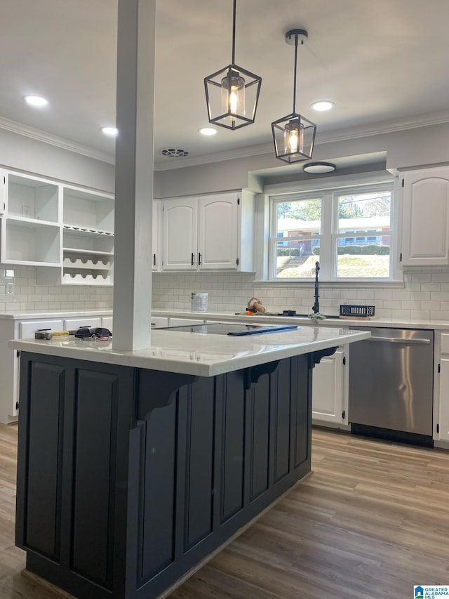 kitchen featuring stainless steel dishwasher, white cabinets, and a kitchen island