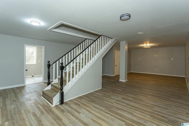 staircase featuring hardwood / wood-style flooring