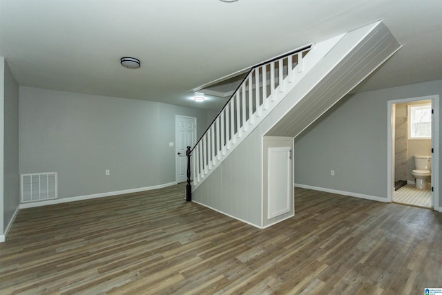 basement with hardwood / wood-style floors